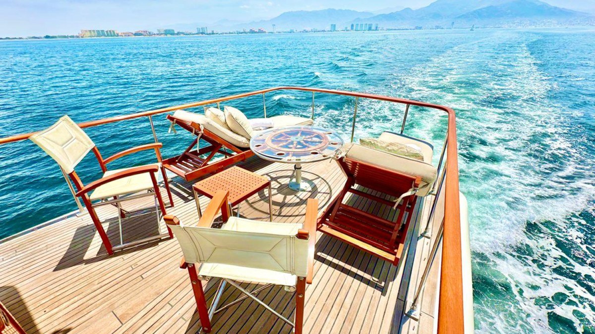 The teak aft deck of the vintage 65 ft Chris-Craft yacht based at Marina La Cruz, set for a day on Banderas Bay