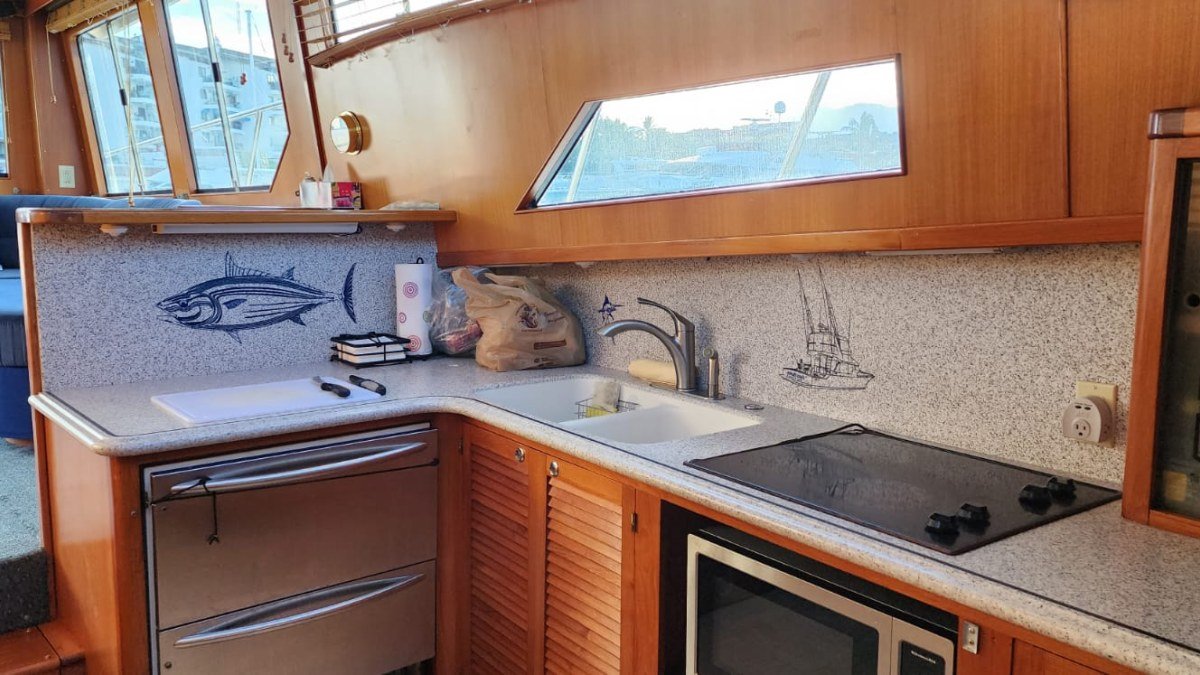 The 60 ft Mikelson sportfishing yacht from Marina Vallarta at anchor on a Puerto Vallarta fishing charter