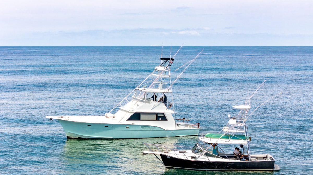 The Ol&rsquo; Salty&rsquo;s Ranch fleet anchored in Banderas Bay off Nuevo Vallarta: the 53-foot Hatteras Steel n Time and the 32-foot super panga Peaceful Easy Feeling