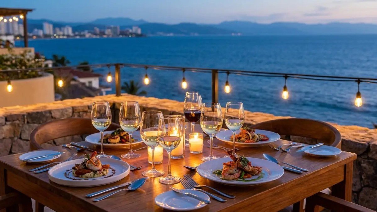 A candlelit dinner table set on a Puerto Vallarta terrace overlooking Banderas Bay, prepared by PVR Private Chef