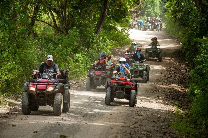 ATV tour crossing the river at Rancho Capomo, Las Palmas