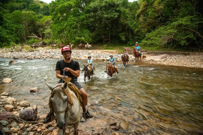 Horseback riders on the jungle trail at Rancho Capomo, Puerto Vallarta