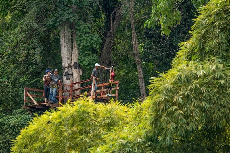 Rider in harness and helmet on the Rancho Capomo zipline tour