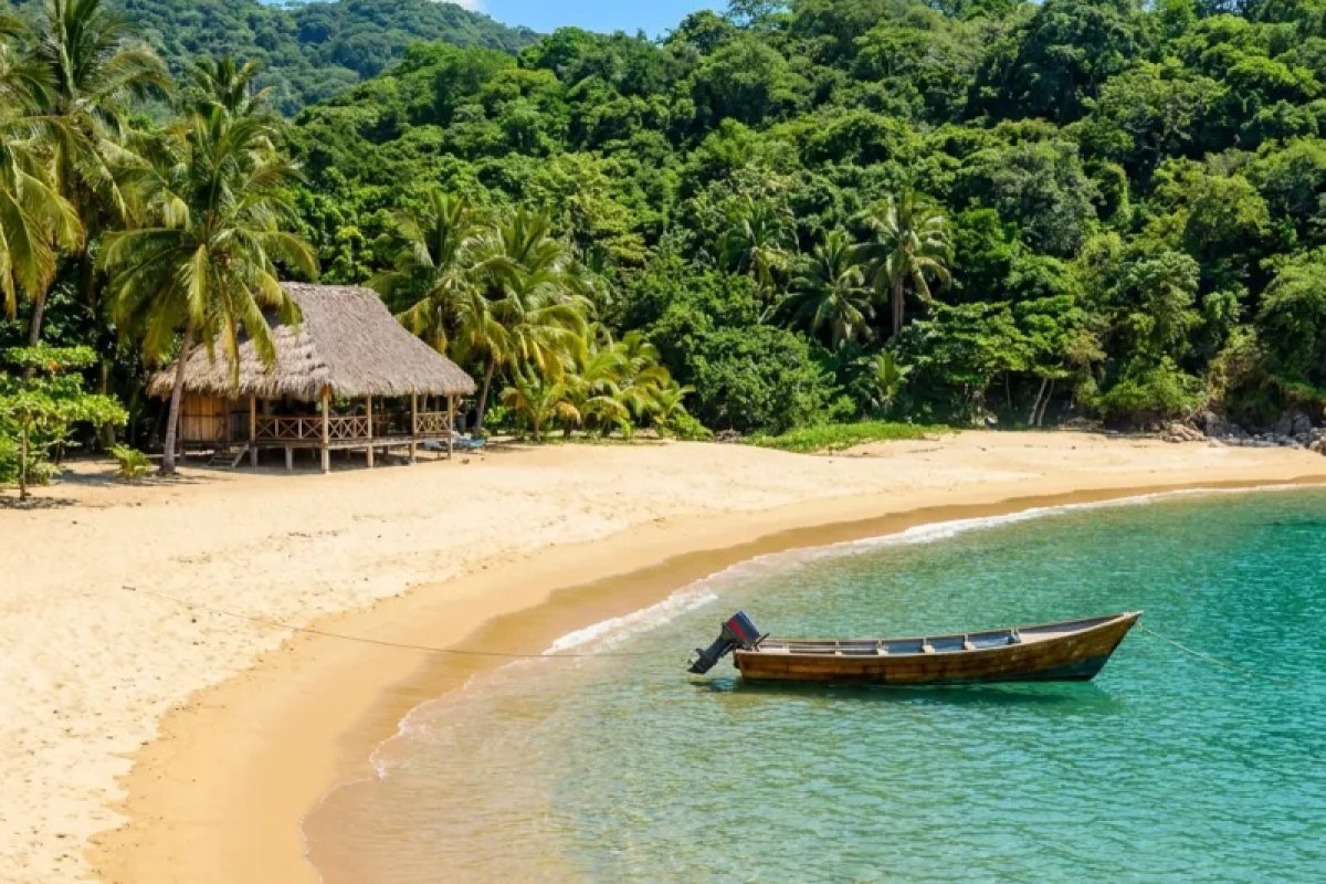 Quiet cove with a palapa and a panga on the shore south of Puerto Vallarta