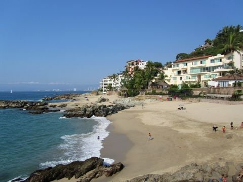 Rocky coves and sand at Playa Conchas Chinas, Puerto Vallarta
