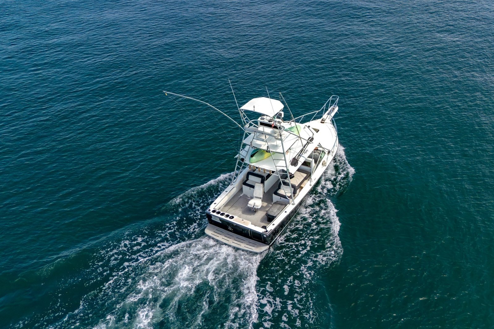 Guanatuna under way seen from above, with her full shade canopy over the main deck